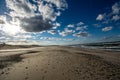 Empty Cape Cod beach on a bright sunny, cold, windy late fall day. Royalty Free Stock Photo