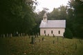 Old White Wooden Church With Graveyard