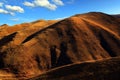 Barren mountains, red land