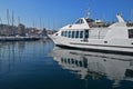 Luxury yacht, boats, sails docking mooring at Marseille old town harbor port on a blue sky calm day, Southern France