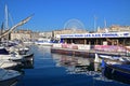 Small boats & sails docking mooring with shuttles to Friuli Islands at Marseille old town harbor port, Southern France