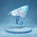 Location Arrow icon. Cracked blue Ice Location Arrow symbol on blue snow podium Royalty Free Stock Photo