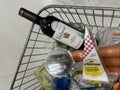 closeup view of food products in customer shopping trolley inside supermarket