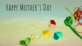 Happy Mother`s Day words with small colorful heart shaped and gift boxes as background. Royalty Free Stock Photo