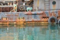 Location Skagway Alaska on side of rusting vessel with colorful water