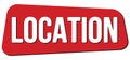LOCATION text on red trapeze stamp sign