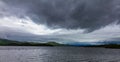 Loch Lomond around Luss Scotland below dramatic cloudcape