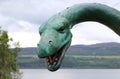 Loch Ness Monster statue with Loch Ness in the background Royalty Free Stock Photo