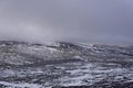 Loch Vrotachan on a cold bleak day on the Plateau above the Glenshee Ski Resort with the Sun trying to come out.