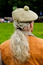 Highland games spectator in traditional dress.