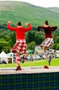 Two girls doing a sword dance.