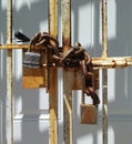 Lock and Chain Close-Up of Urban Building Entrance. Royalty Free Stock Photo
