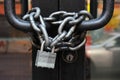 Lock with chain on a closed door.