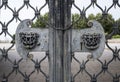 Lock, chain and handles in the shape of fairy-tale animal heads on the gate grating of the medieval Kazan Kremlin