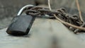 ÃÂ lock on a chain holds the boat