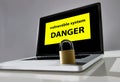 Lock on computer laptop keayboard with warning message danger vulnerable system in hacker attack concept Royalty Free Stock Photo