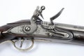 Lock detail of an 18th century flintlock pistol Royalty Free Stock Photo