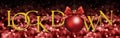 Lock down text with christmas ball with red satin ribbon bow on red blurred lights background Royalty Free Stock Photo