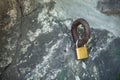 the lock is fastened to the iron rod. big piece of rock. love symbol