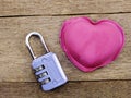 Lock with the heart as a symbol of love on wooden background Royalty Free Stock Photo