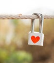 Lock with heart symbol on rope bridge as a promise of lover Royalty Free Stock Photo