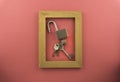 Lock and key isolated by pink colour background. soft focus Royalty Free Stock Photo