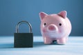 Lock with a piggy bank on the table Royalty Free Stock Photo