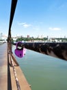 Lock on the railing of the bridge over the river. In the far visible city. Love. Faithfulness. Marriage