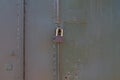 The lock on the rusty metal gate on the garage Royalty Free Stock Photo