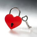 Lock in the shape of a red heart with small key. Love in wedlock, marriage, or Valentine`s Day concept Royalty Free Stock Photo