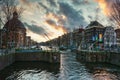 The lock in The Singel canal in the old town of Amsterdam. Royalty Free Stock Photo