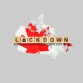 Lockdown. Canada. The inscription on wooden blocks, against the background of the map of Canada. Closing the country to