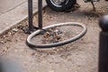 Locked bicycle wheel at bike parking Royalty Free Stock Photo