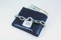 Locked brown leather wallet. Leather wallet with chain and lock. Royalty Free Stock Photo