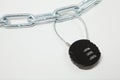 Cipher padlock on chain on white background. Security concept.