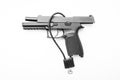 Locked disarmed secured handgun white background