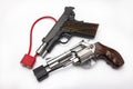 Locked disarmed and secured semi automatic hand gun and revolver pistol gun on white background , Gun control , Gun Safety Royalty Free Stock Photo