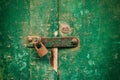 Locked door. Closed old rusty padlock on a distressed wooden door Royalty Free Stock Photo