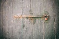 Locked door. Closed old rusty padlock on a weathered wooden door Royalty Free Stock Photo