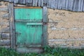 Locked green door in a country house
