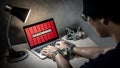 Locked hands and ransomware cyber attack on laptop