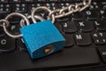 Locked laptop with chain and padlock