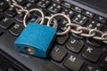 Locked laptop with chain and padlock Royalty Free Stock Photo