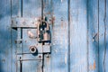 Locked latch and padlock on old door Royalty Free Stock Photo