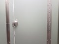 Locked or latched bathroom or restroom stall door Royalty Free Stock Photo