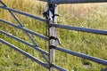 Locked metal framed farm gate