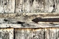 Locked old wooden door of a rural barn. Texture of a wooden board and rusty iron staples. Closed door of an ancient Royalty Free Stock Photo