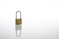 Locked padlock as security or privacy concept, isolated on white background with reflex