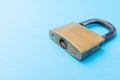 Old Padlock on a blue background. Copy space Royalty Free Stock Photo