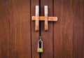 Locked padlock with chain at brown wooden door background Royalty Free Stock Photo